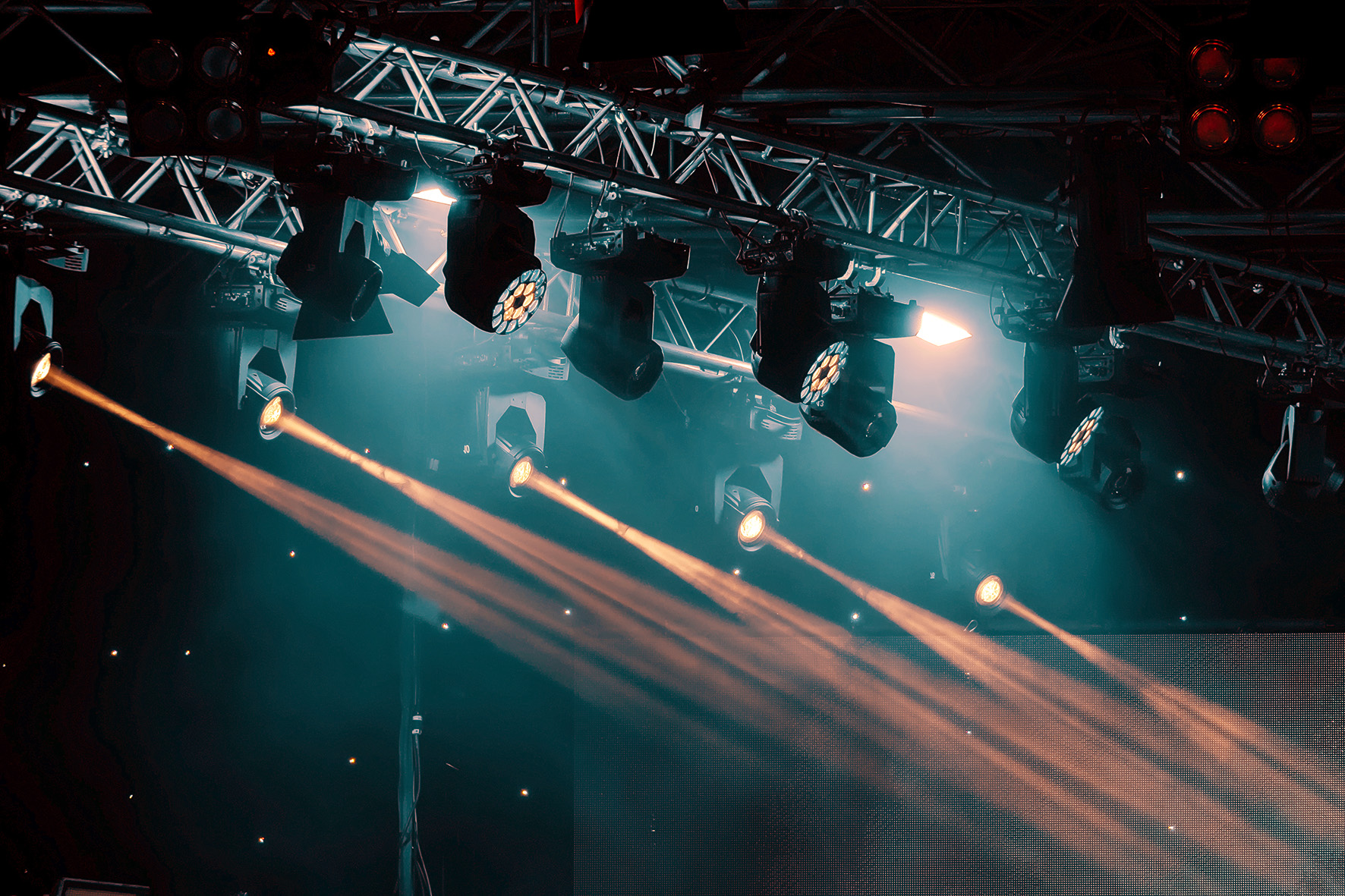 luminous rays from concert lighting against a dark background, musical instrument concept