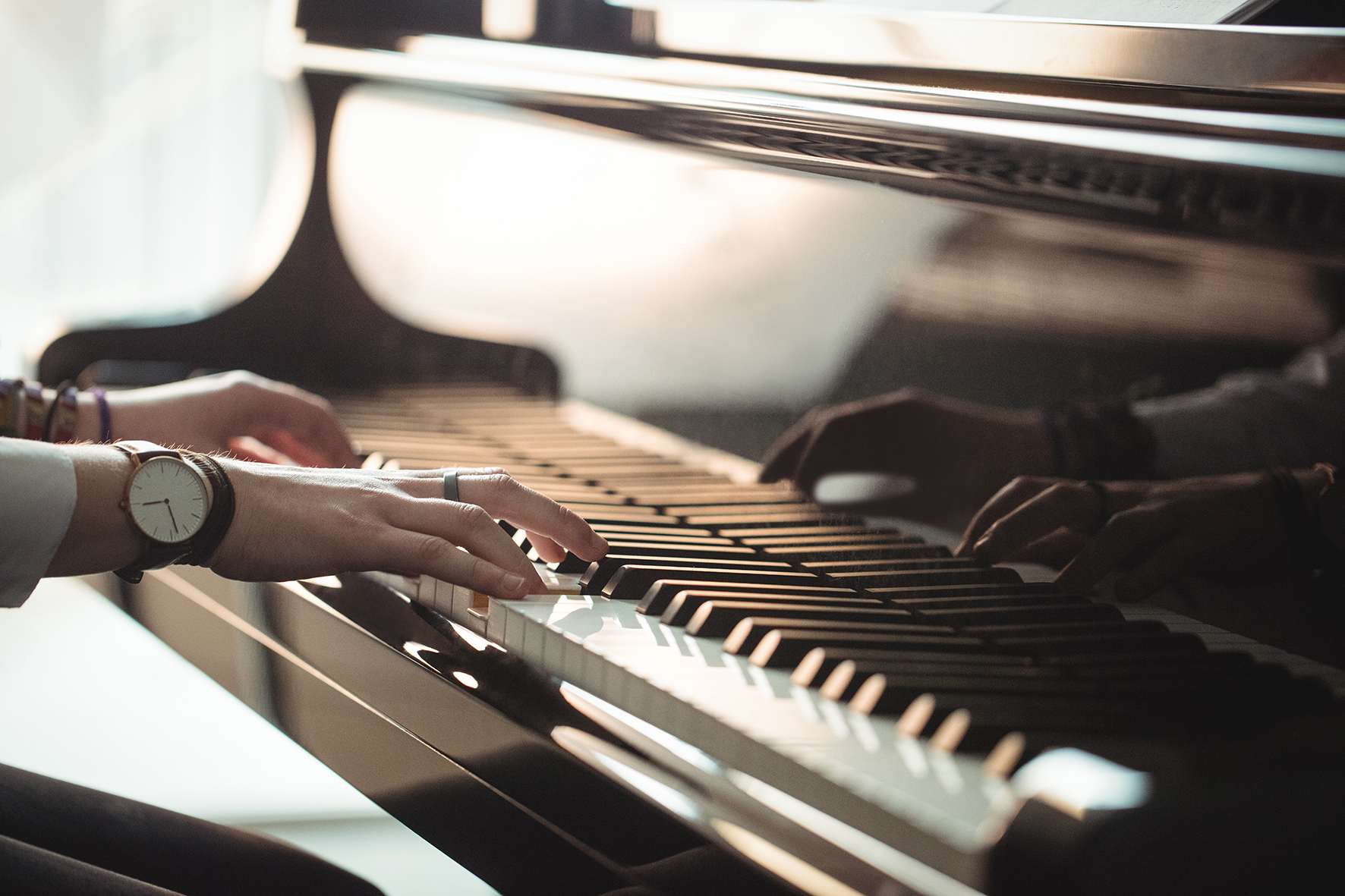 Woman playing a piano in music studio