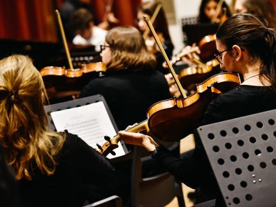 Valencia, Spain - January 25, 2019: Musicians during a classical music concert, playing violins.