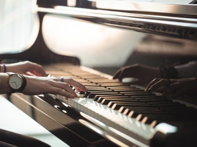 Woman playing a piano in music studio